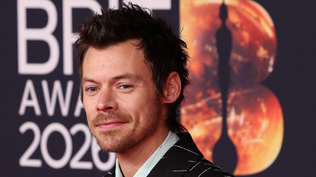 Harry Styles poses on the red carpet of the 2026 Brit Awards in Manchester