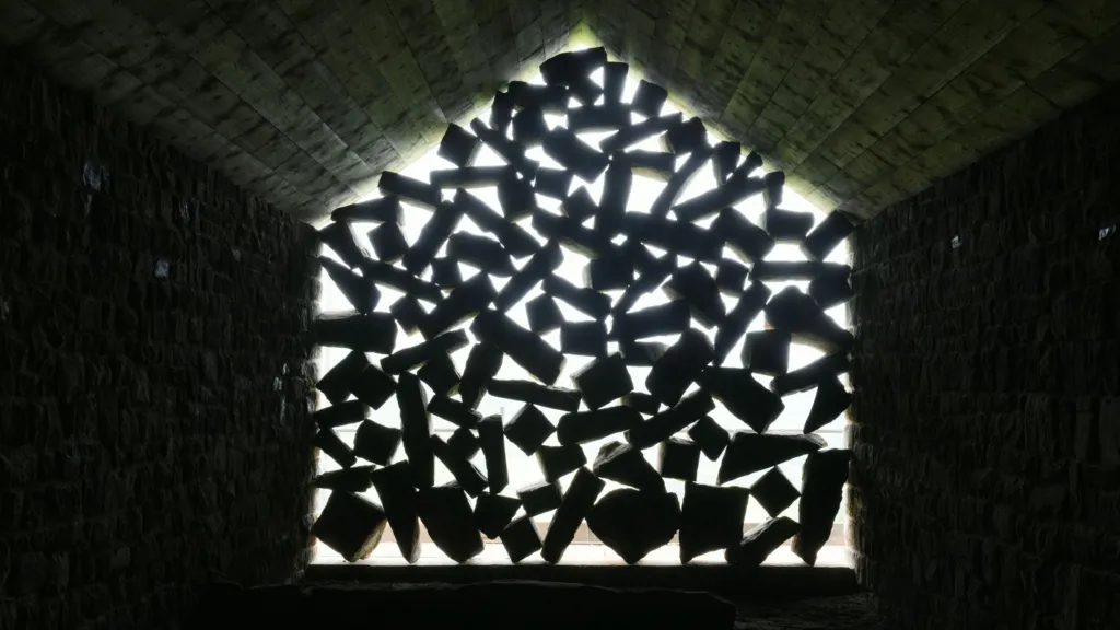 Barn porch filled with large stones 