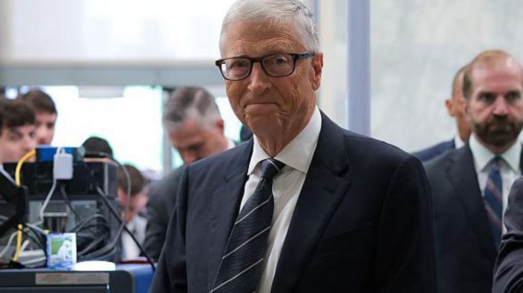 Bill Gates walks through security as he arrives to testify at a closed-door interview with the House Oversight Committee on Capitol Hill