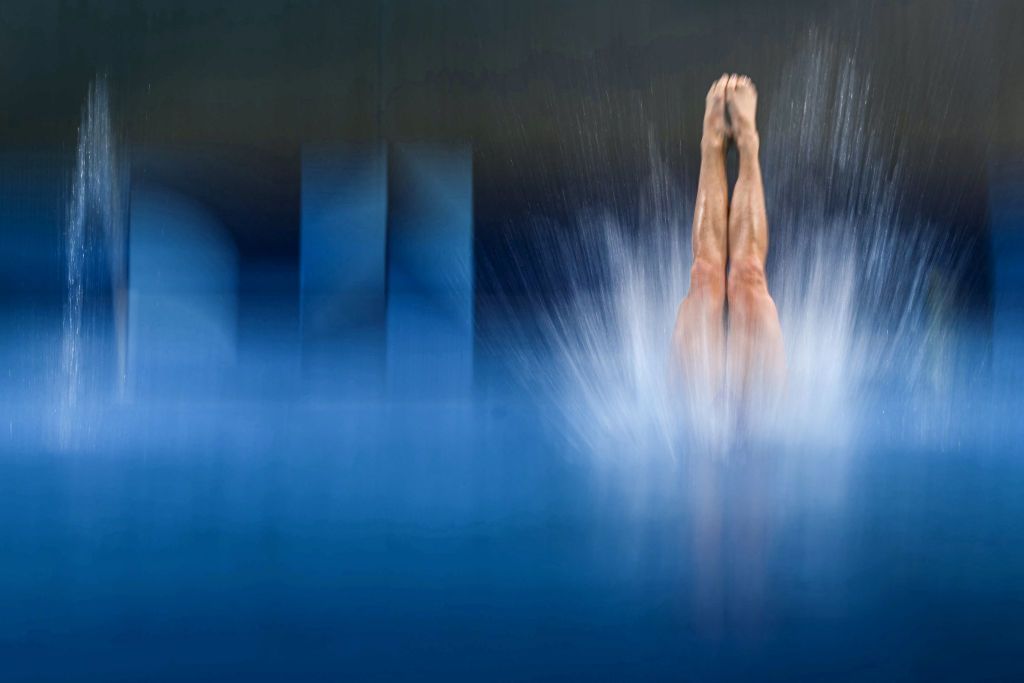 South Africa's Julia Vincent dives into the water.