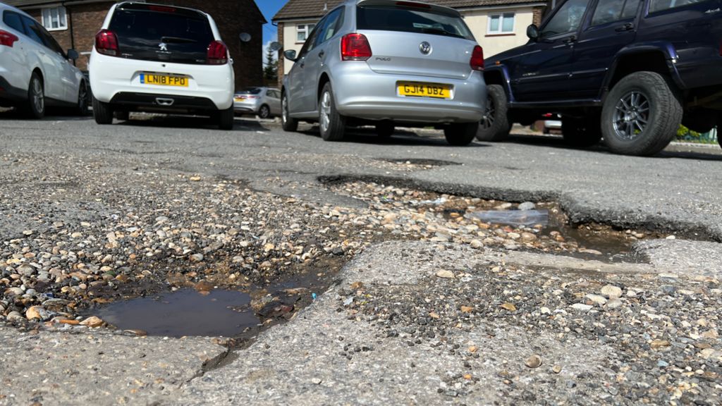 Potholes in a road