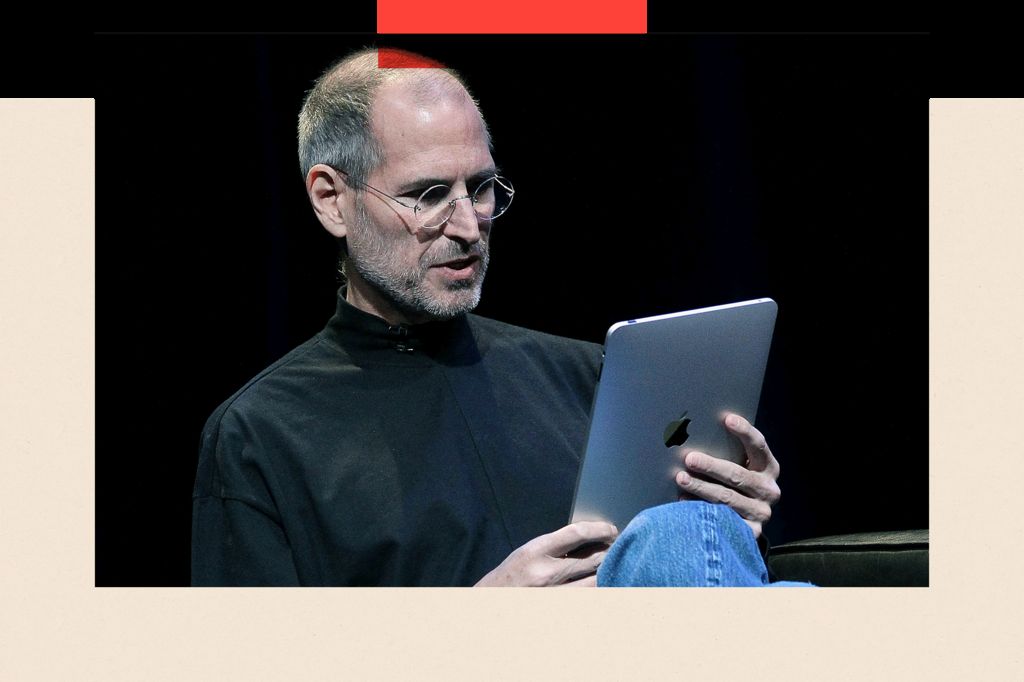 Steve Jobs with an iPad in hand