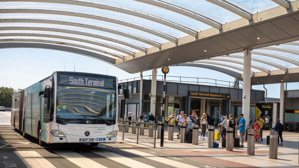 A shuttle bus for long stay passengers pulls up at Gatwick Airport's South Terminal 