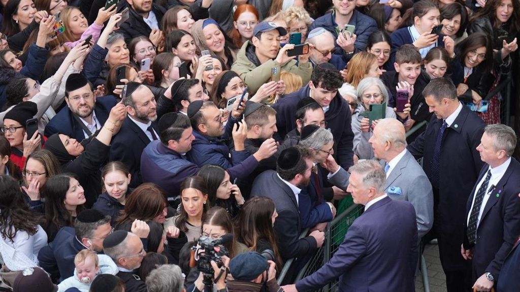 The King meets a large crowd of well-wishers during his visit