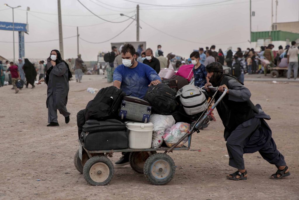 Afghans return from Iran at Islam Qala border in Herat, Afghanistan.
