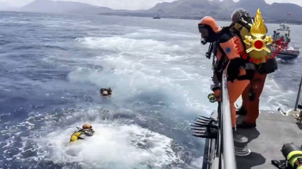 A handout video grab made available by Vigili del Fuoco shows cave divers from the Italian fire brigade as they prepare to resume inspections of the Bayesian yacht's wreck, off the coast of Sicily