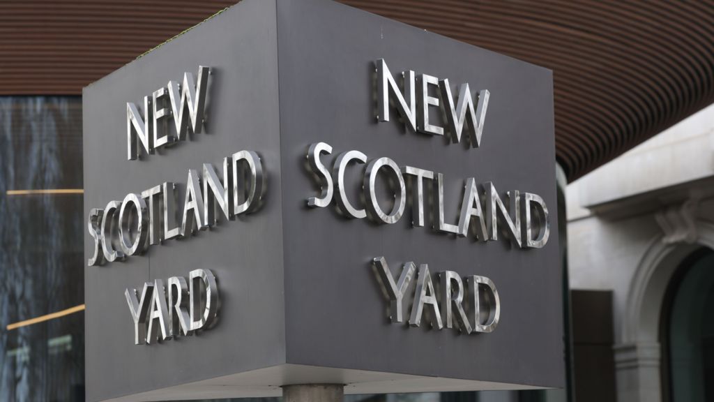 A general view of a New Scotland Yard sign outside the Metropolitan Police headquarters.