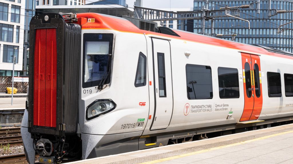 A white Transport for Wales train