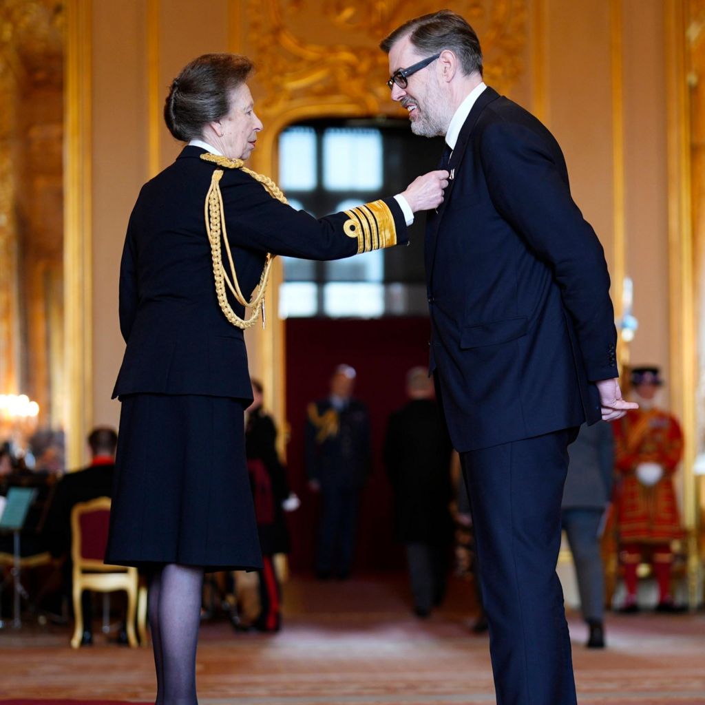 Richard Osman being made an Officer of the Order of the British Empire (OBE) by the Princess Royal at Windsor Castle, Berkshire.