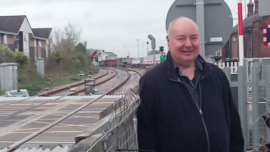 Dennis Fancett standing by a railway line