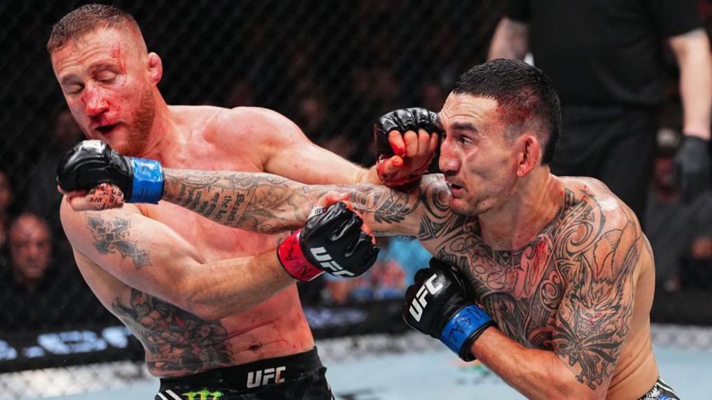 Justin Gaethje is punched on the chin by Max Holloway in a UFC fight