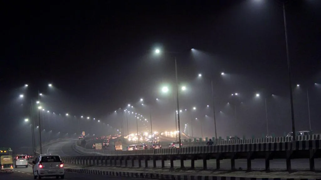 Cars driving through a highway as toxic smog covers the capital's skyline and air quality deteriorates further in the national capital after Dussehra celebrations, on October 28, 2020 in New Delhi, India.