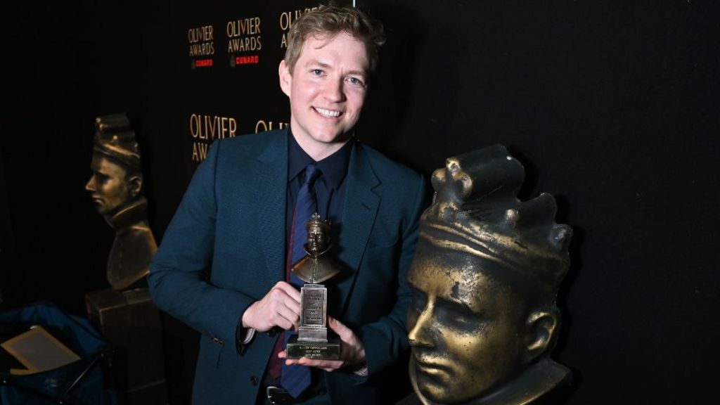 Jack Holden, winner of the Best Actor award for "Kenrex", poses backstage at The Olivier Awards 2026, celebrating their 50th anniversary, at Royal Albert Hall on April 12, 2026 in London, England