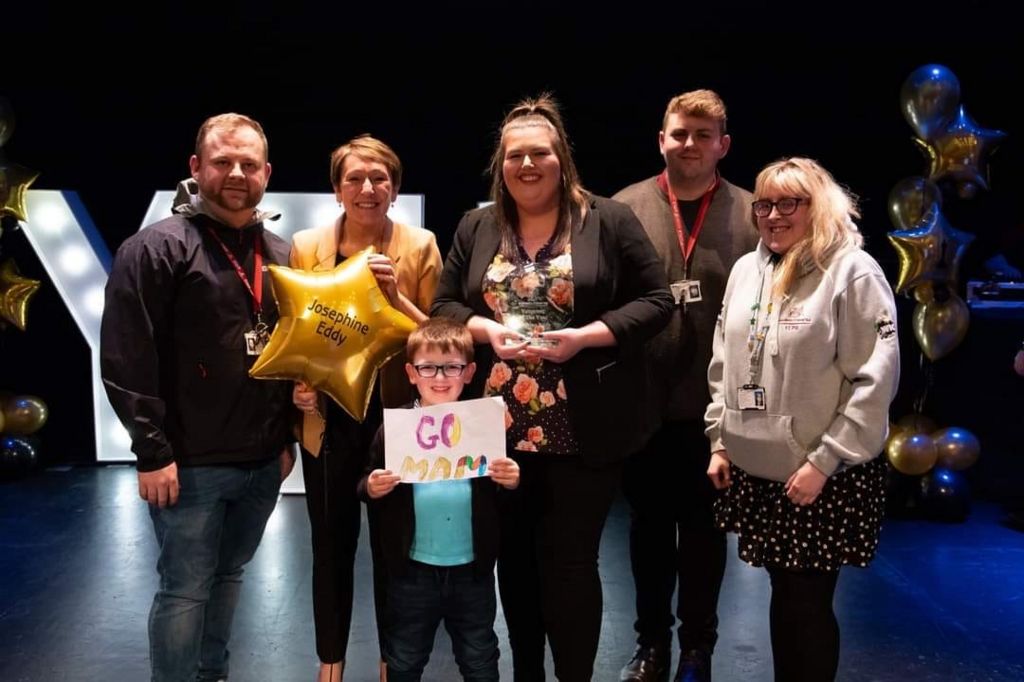 Josie with her family when she won the volunteer of the year award