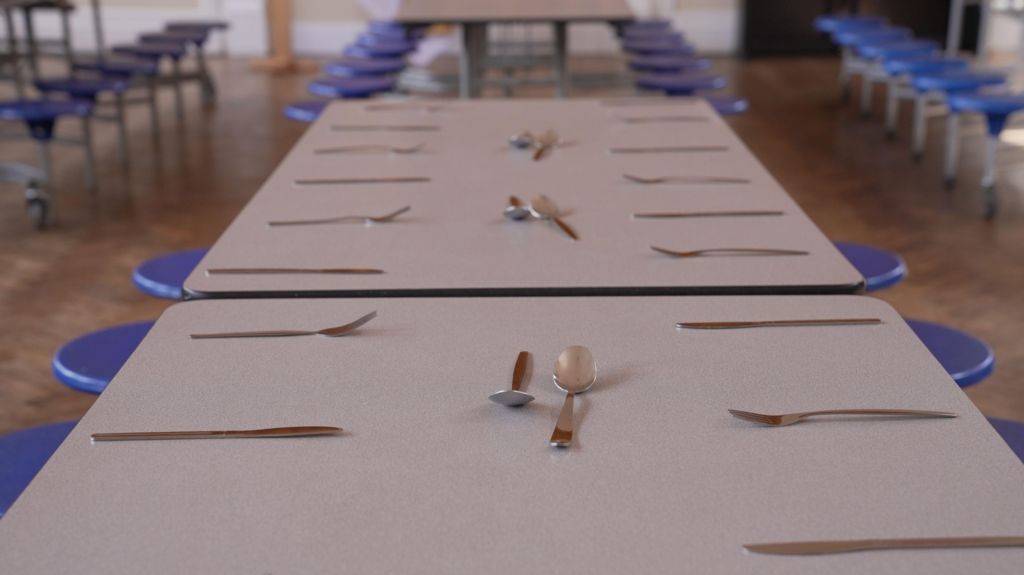 A table laid out for school dinners