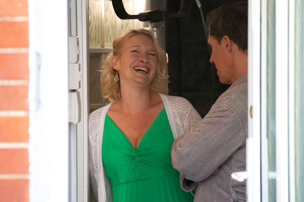 Actress Joanna Page laughing in a doorway with Rob Brydon while filming Gavin and Stacey