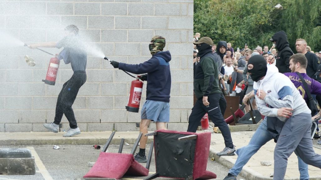 Rioters seen charging and spraying fire extinguishers