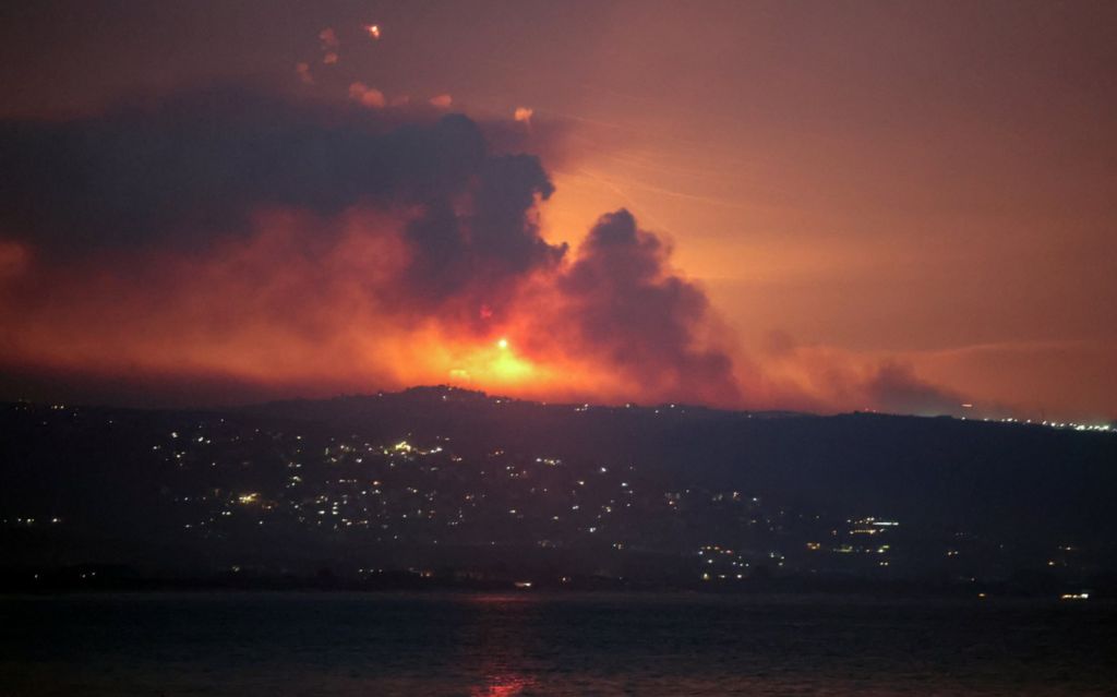 A view shows smoke and fire on the Lebanese side of the border with Israel, after Israel said it had noted armed group Hezbollah preparing to attack Israel and had carried out pre-emptive strikes on Hezbollah targets in Lebanon