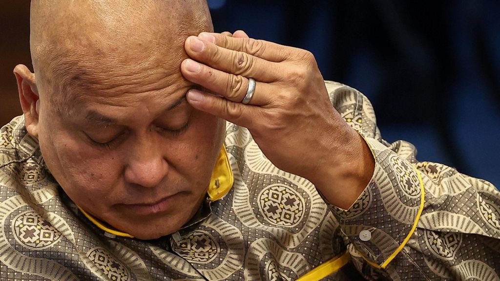 Close up image of an exasperated Philippine senator Ronald dela Rosa