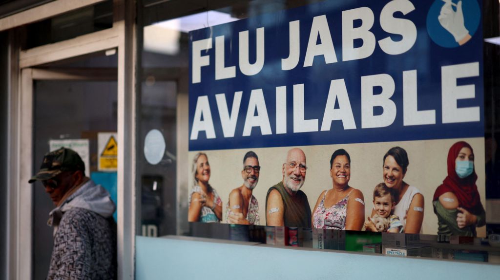 Flu jab advert in window