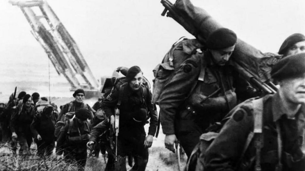 Royal Marines move off the Normandy beaches during the advance inland from Sword Beach