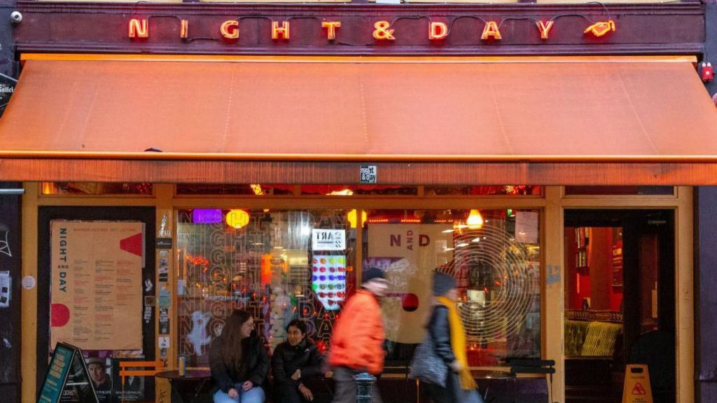 People walking past the Night and Day music venue in Manchester