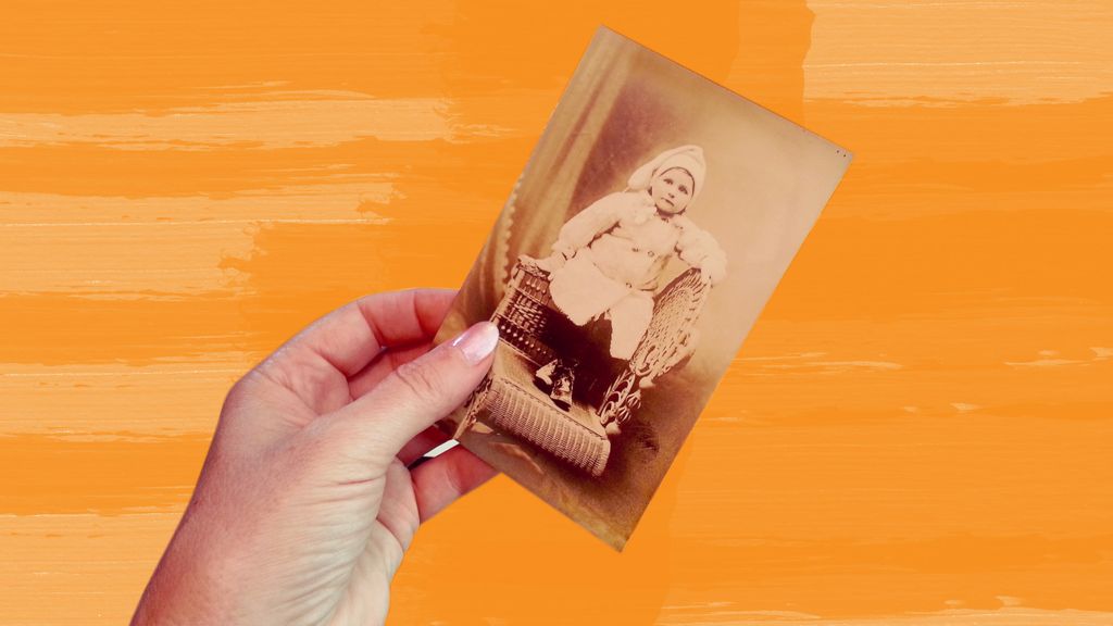 Woman holding old photo