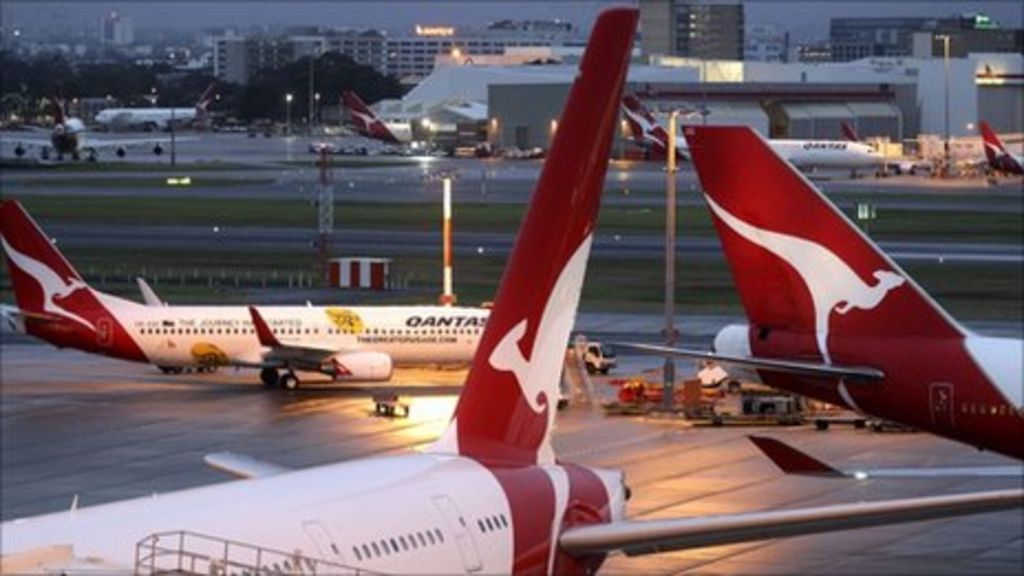 Qantas cuts growth as service hit