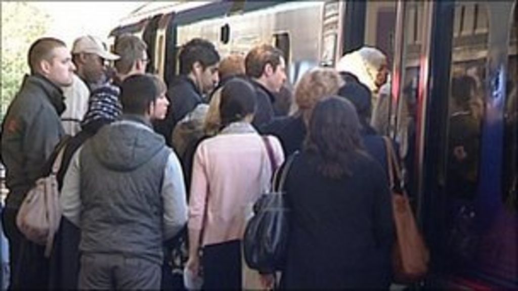 Passengers queuing to get onto FTPE train