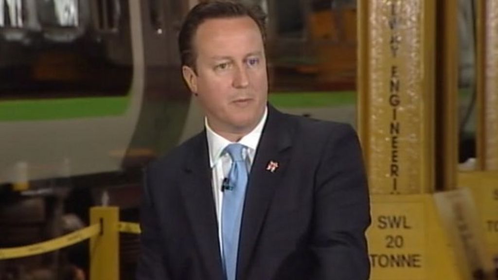 David Cameron and Nick Clegg with engineers at the Soho Depot in Smethwick