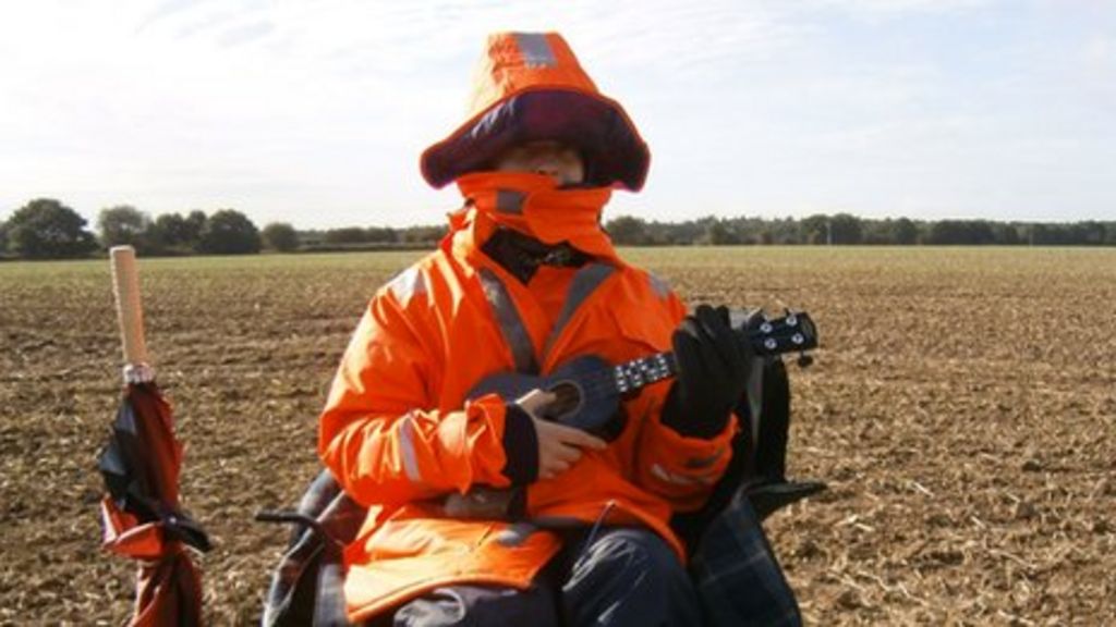 university-graduate-finds-work-as-human-scarecrow-bbc-news