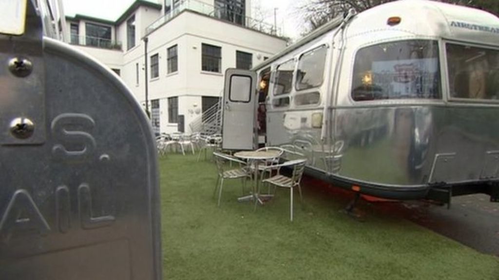 Bristol guesthouse puts caravans on roof - BBC News