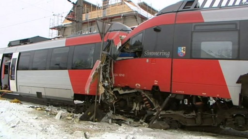 Emergency services remove an injured person from a train wreck near Vienna