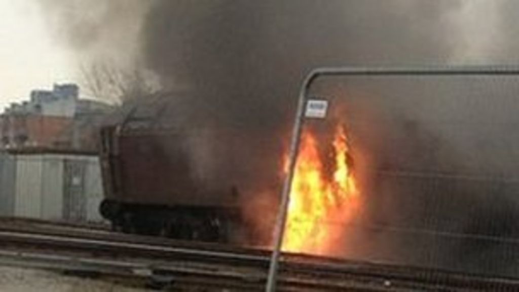 Fire crews at a derailed train in Salford