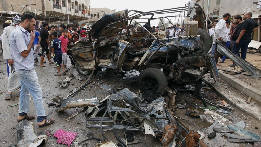 Dozens killed by car and suicide bombs in Iraqi cities - BBC News