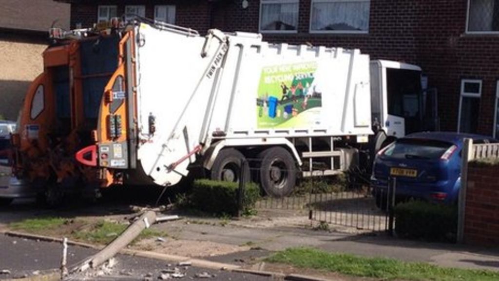 'Runaway' bin lorry stops inches from house BBC News