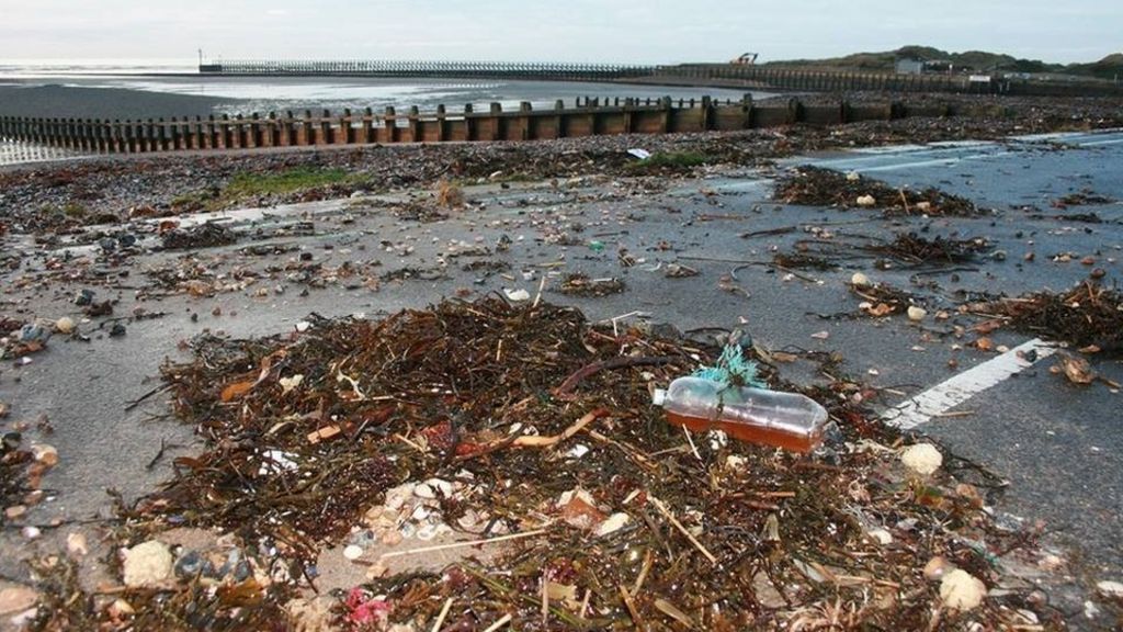 Clearing up Littlehampton beach after storm surges BBC News