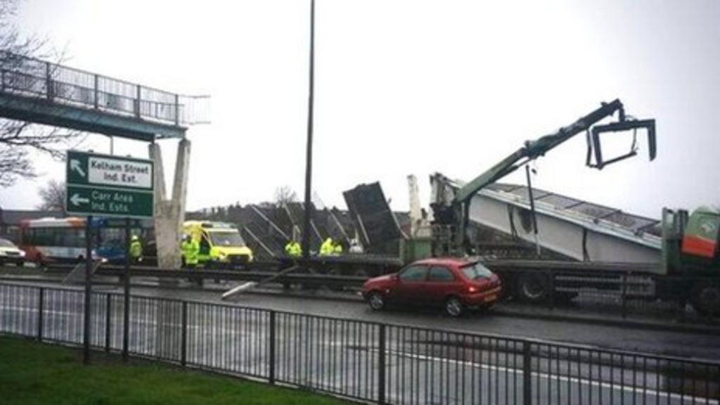 Doncaster footbridge collapses after being hit by crane on lorry - BBC News