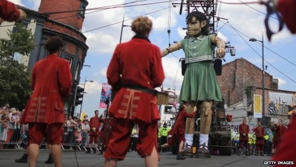 Liverpool crowds greet giant puppets BBC News