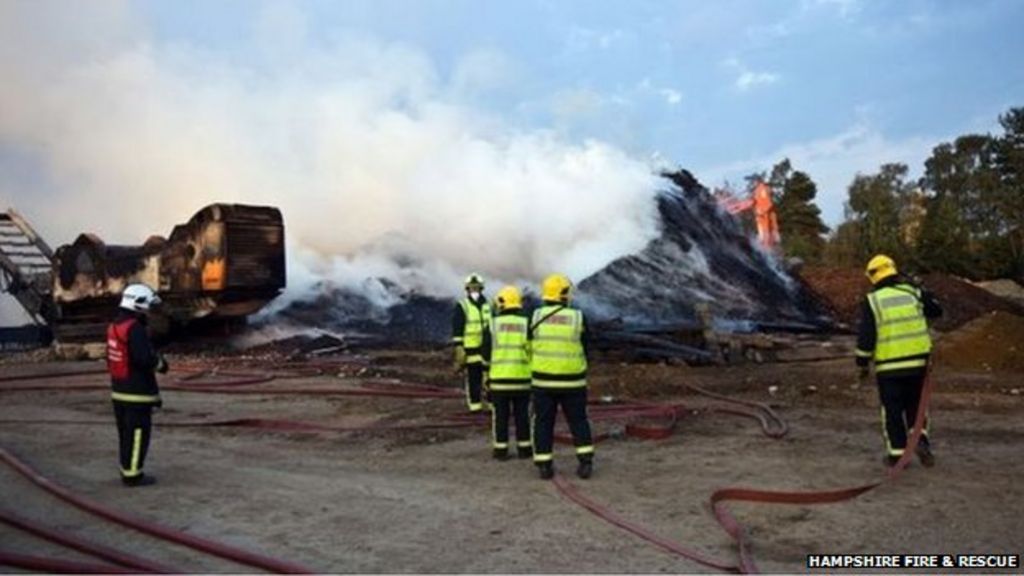 Wood chips on fire in Eversley storage yard - BBC News