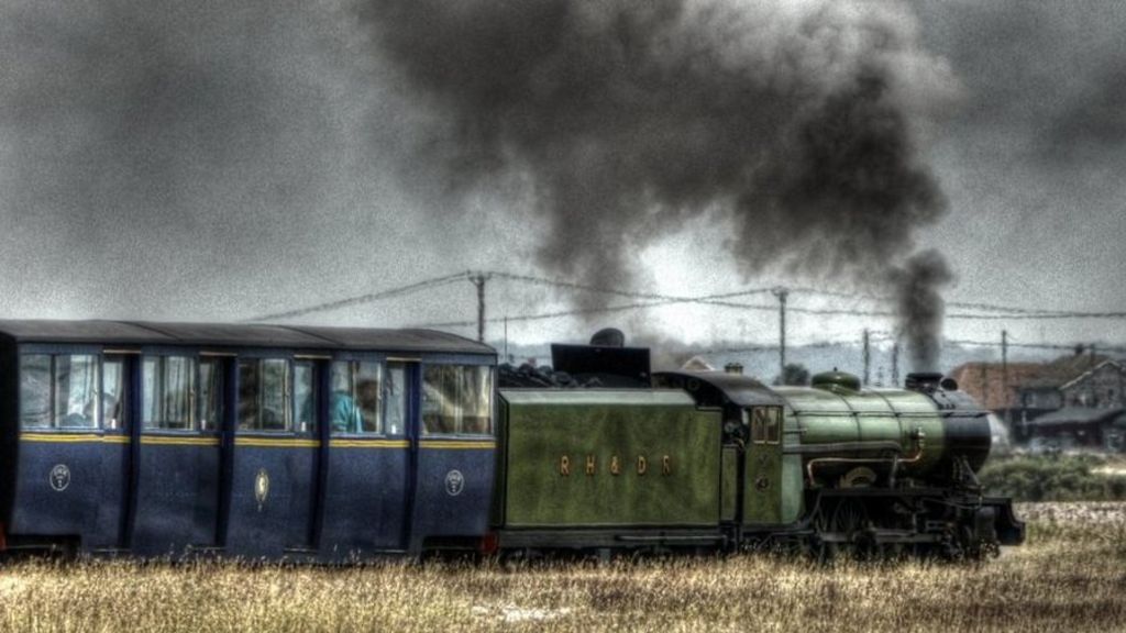 Green Goddess locomotive leaving Dungeness station