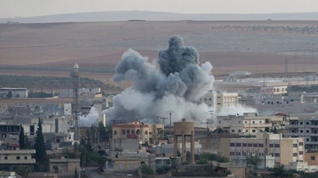 Kobane: Air strikes 'stall IS advance' on Syrian border town - BBC News