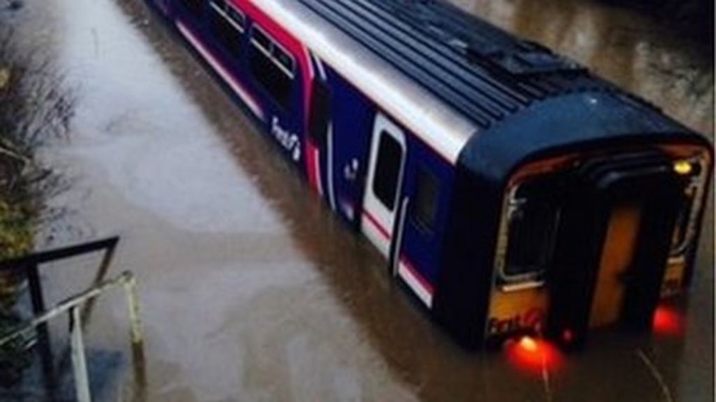 Passenger hurt as train hits flood in East Ayrshire - BBC News