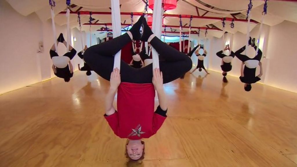 Why upside-down yoga is catching on in Australia - BBC News