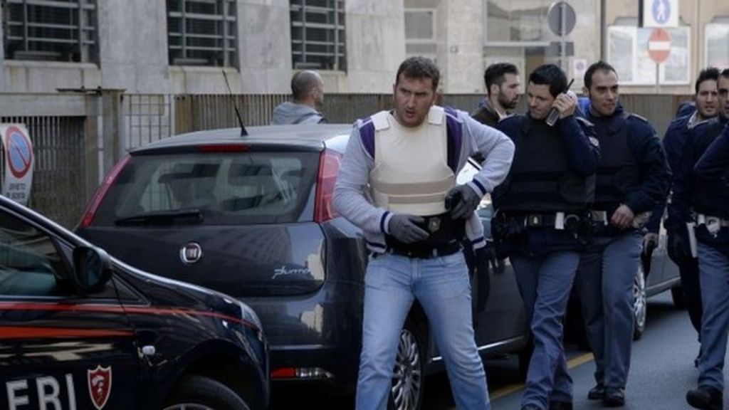 Milan court shooting: Man kills lawyer, judge and co-defendant - BBC News