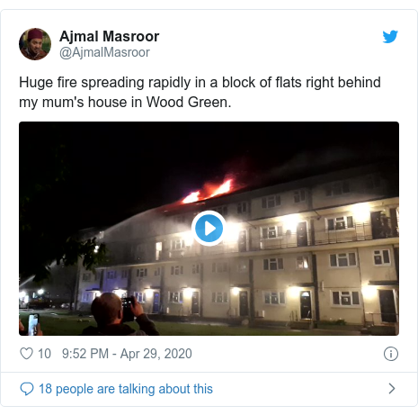 Twitter post by @AjmalMasroor: Huge fire spreading rapidly in a block of flats right behind my mum's house in Wood Green. 