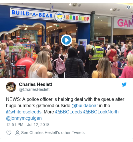 Twitter post by @CharlesHeslett: NEWS  A police officer is helping deal with the queue after huge numbers gathered outside @buildabear in the @whiteroseleeds. More @BBCLeeds @BBCLookNorth @jonnymcguigan 