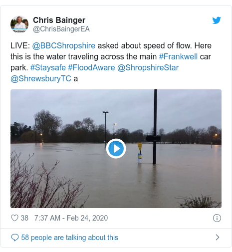 Twitter post by @ChrisBaingerEA: LIVE  @BBCShropshire asked about speed of flow. Here this is the water traveling across the main #Frankwell car park. #Staysafe #FloodAware @ShropshireStar @ShrewsburyTC a 