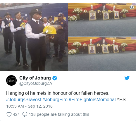 Twitter post by @CityofJoburgZA: Hanging of helmets in honour of our fallen heroes. #JoburgsBravest #JoburgFire #FireFightersMemorial ^PS 
