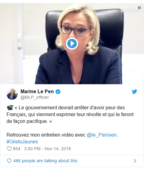 Twitter post by @MLP_officiel: 📹 « Le gouvernement devrait arrêter d'avoir peur des Français, qui viennent exprimer leur révolte et qui le feront de façon pacifique. »Retrouvez mon entretien vidéo avec @le_Parisien. #GiletsJaunes 